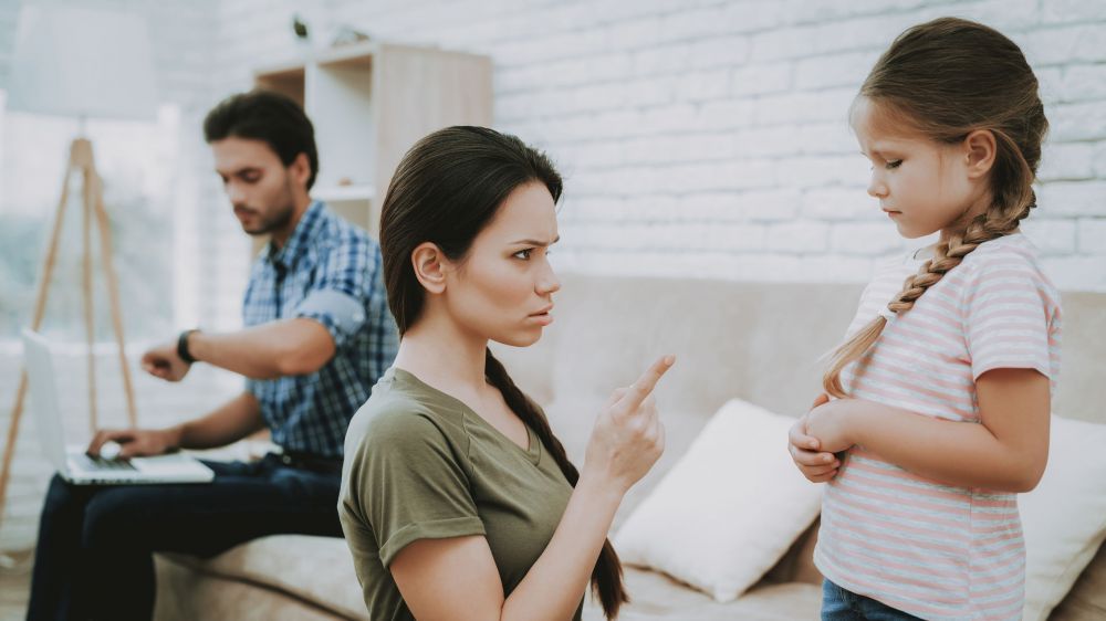 Mom Scolds Daughter and Father Working on Laptop.