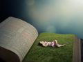 Woman laying on grass field in Bible