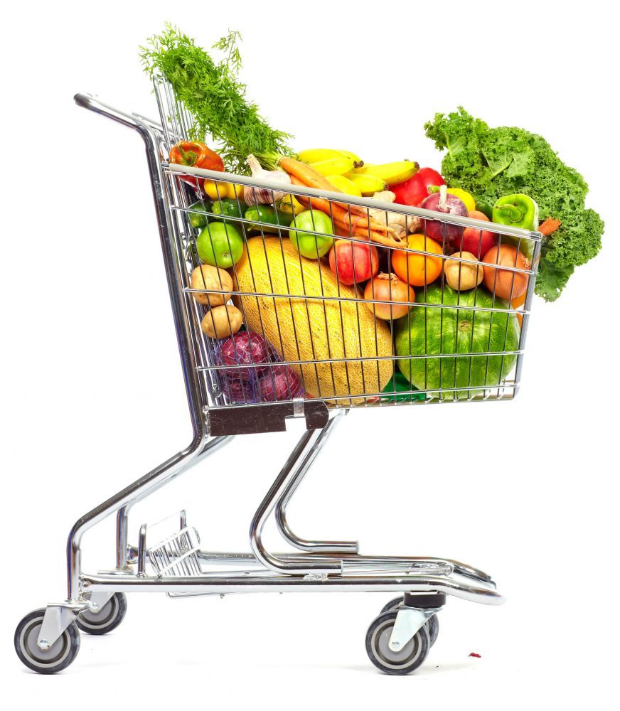 Grocery shopping cart with vegetables and fruits.