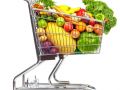 Grocery shopping cart with vegetables and fruits.