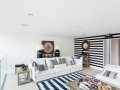 Black-and-white-striped-accent-wall-works-with-a-wide-range-of-styles