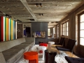 Colorful-accent-wall-brings-contemporary-appeal-to-a-rustic-living-room