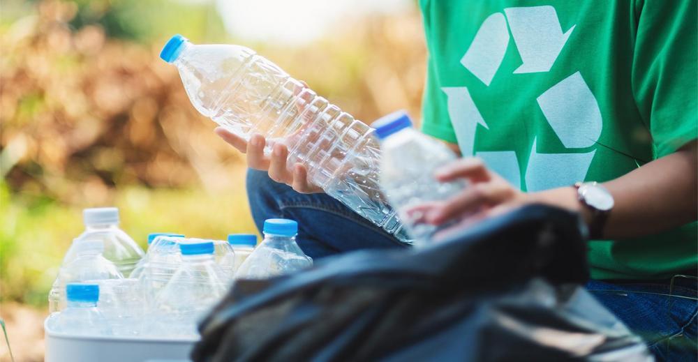 Nextek-Recycling-Bottles-Hand-AdobeStock_320996786