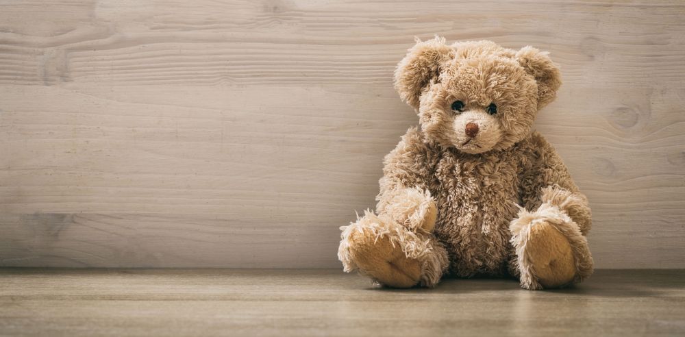 Teddy bear on a wooden floor