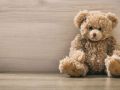 Teddy bear on a wooden floor