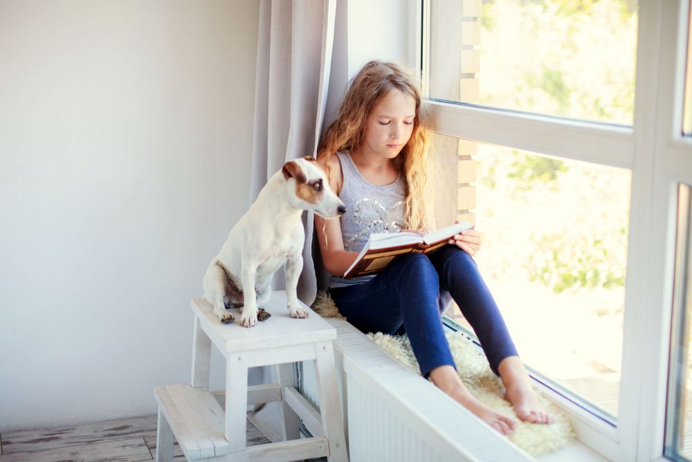 Girl reading book at home