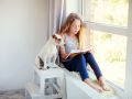 Girl reading book at home