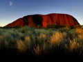 the-sun-sets-on-ayers-rock-one-of-australias-major-tourist-destinations-attracting-400000-visitors-every-year.jpg