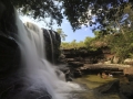 tourists-bathe-at-the-el-cuarzo-waterfall-locally-referred-to-as-the-river-of-five-colors-in-cano-cristales-in-the-colombias-sierra-de-la-macarena-national-park.jpg